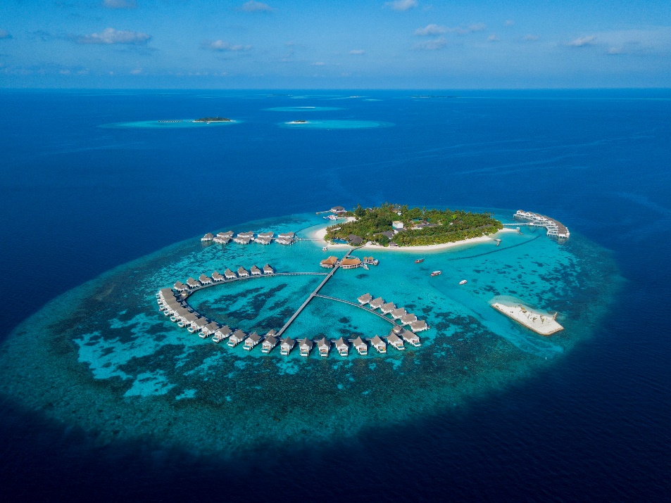An island with huts in the oceanAI-generated content may be incorrect.