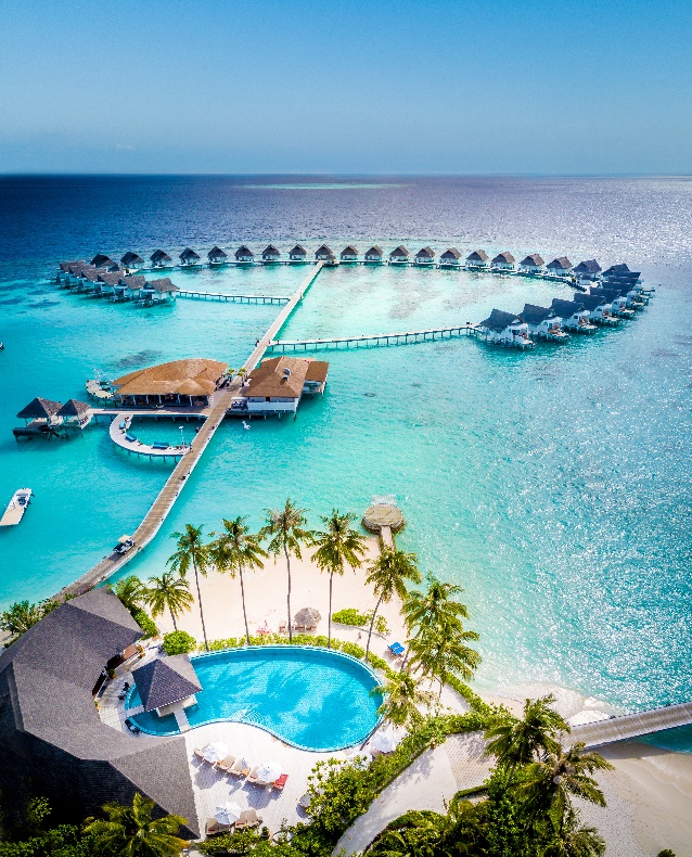 A swimming pool and a resort in the waterAI-generated content may be incorrect.